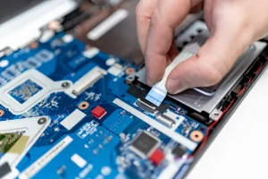 Person Repairing a PCB board